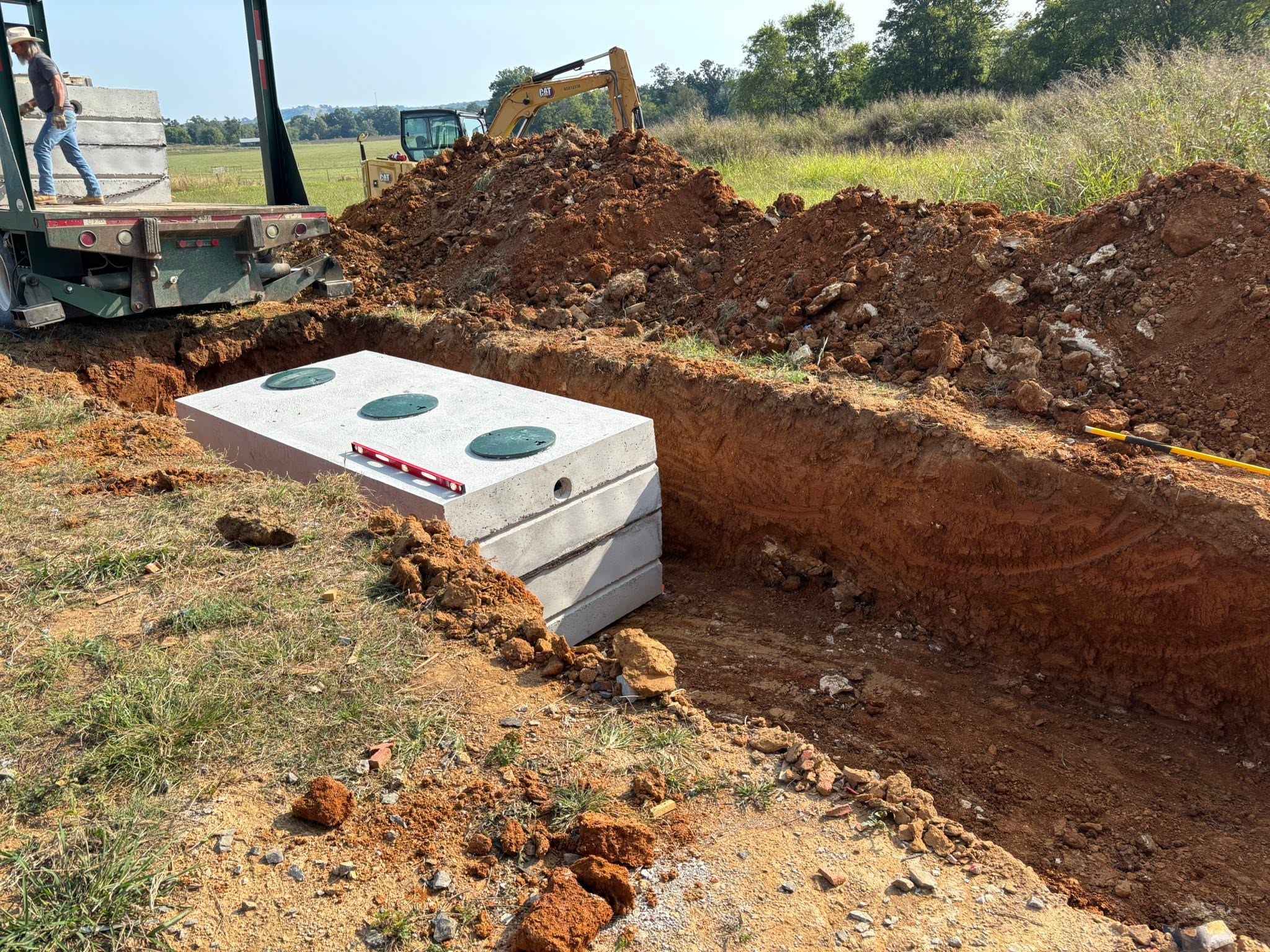 Concrete septic tank installation and excavating on a Wilson County job site Concrete septic tank installation and excavating on a Wilson County job site