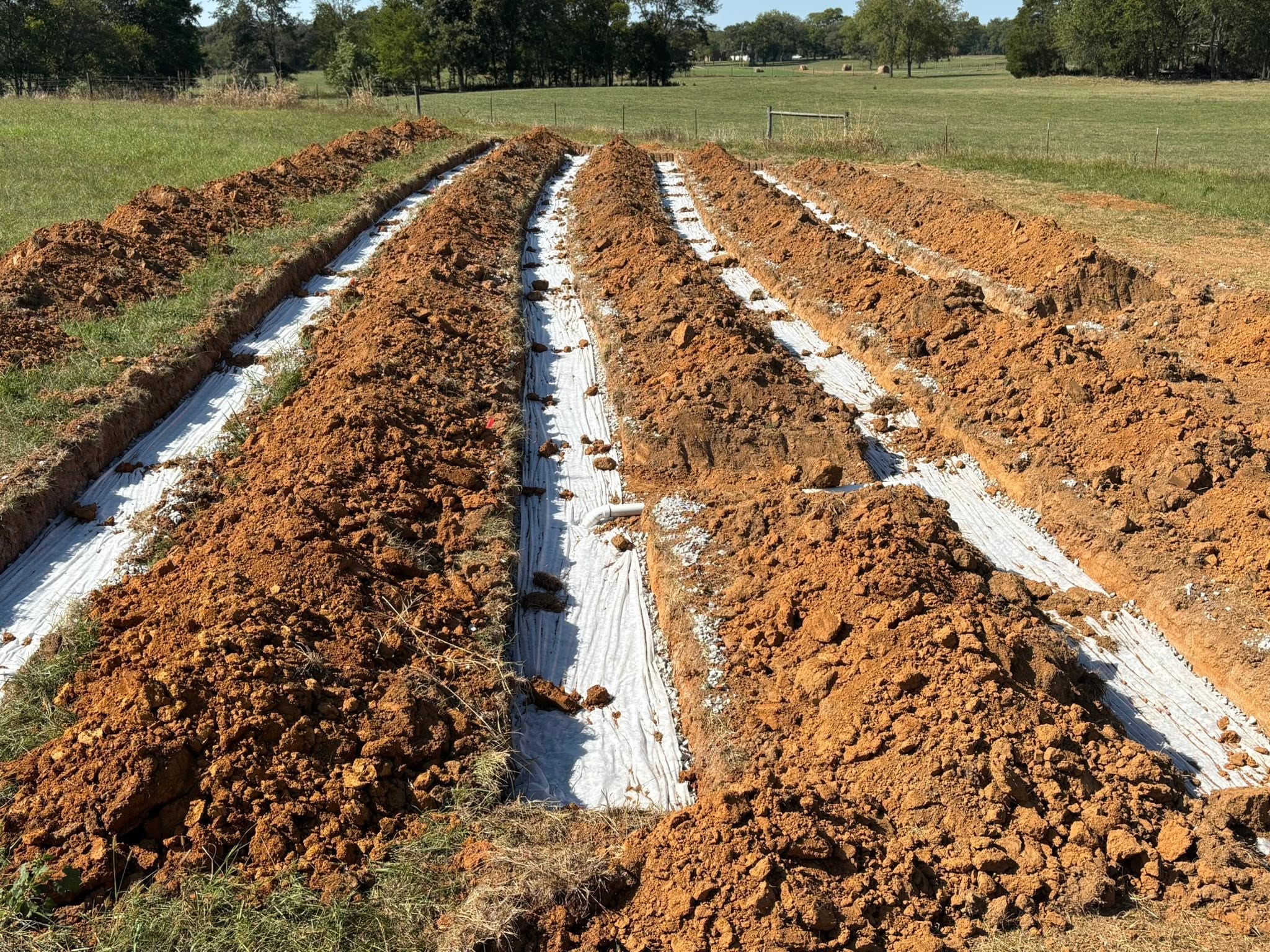Septic system drain field trenches excavated in Lebanon, TN red clay Septic system drain field trenches excavated in Lebanon, TN red clay